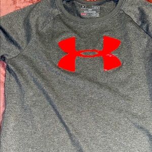 Under Armor tee great for the summer, size large but has shrunk a bit.